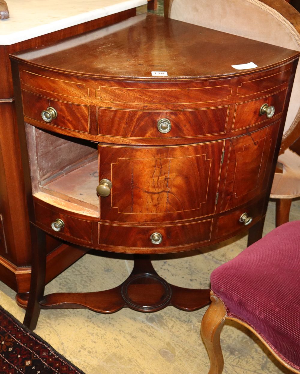 A Georgian mahogany bow front corner washstand, W.66cm, D.47cm, H.84cm